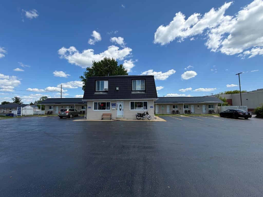 a parking lot in front of a building at Perth Plaza Inn & Suites in Perth