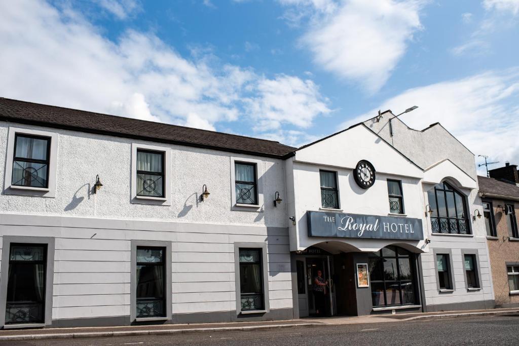a white building with a sign that reads the pyramid hotel at Stamps by Eight Continents The Royal Hotel, Cookstown in Cookstown