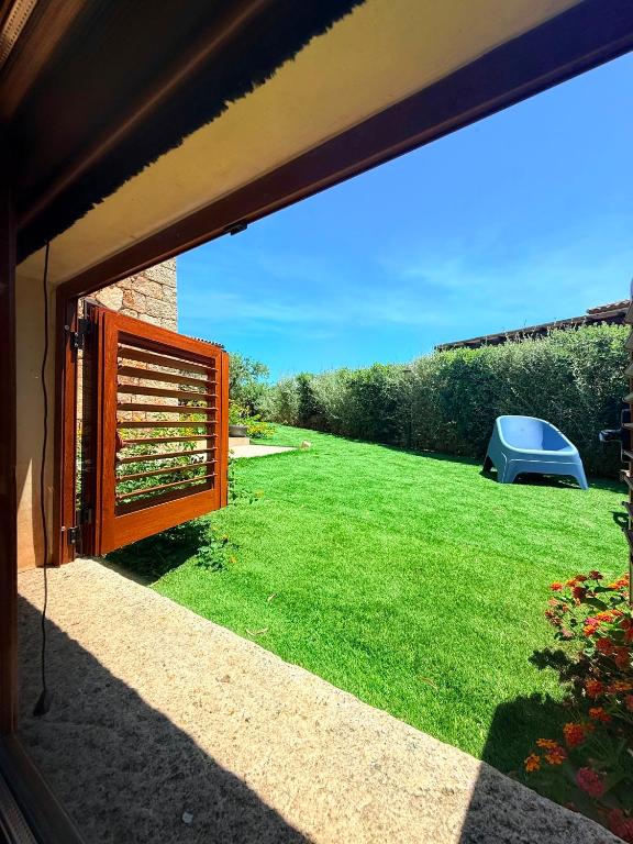 a view of a yard from a window of a house at Villa del Golfo in Olbia