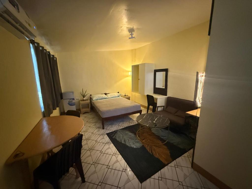 a living room with a couch and a table at Homestay de Baclayon in Baclayon