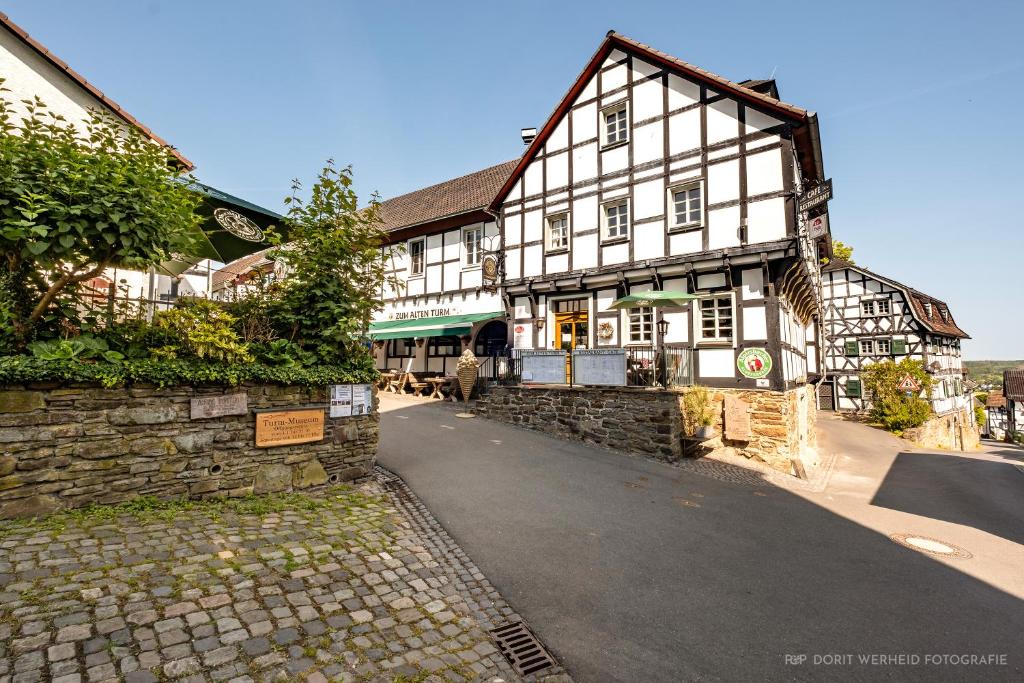 an old building on the side of a street at Zum Alten Turm in Hennef