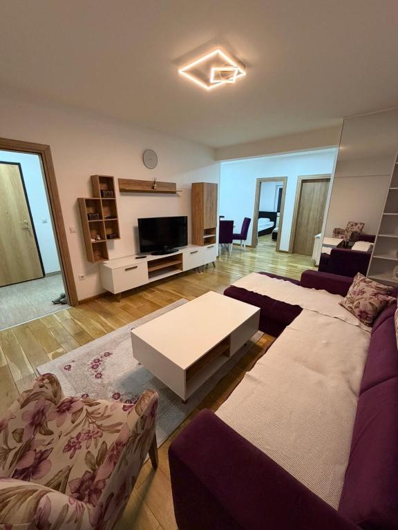 a living room with a couch and a coffee table at Apartman Lala in Sarajevo