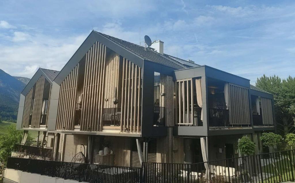 a building with a bunch of balconies on it at ALOHA Suites - Alp LOdge HAus in Haus im Ennstal