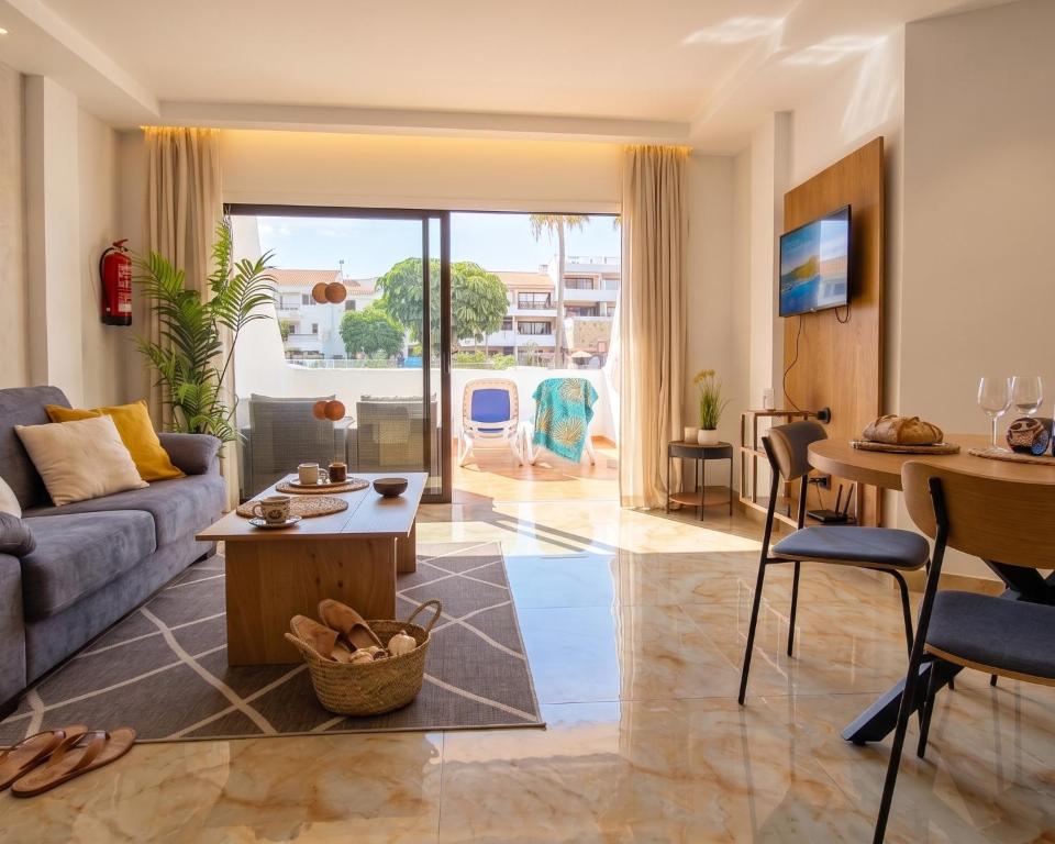 a living room with a couch and a table at Mandarina 119 in San Miguel de Abona