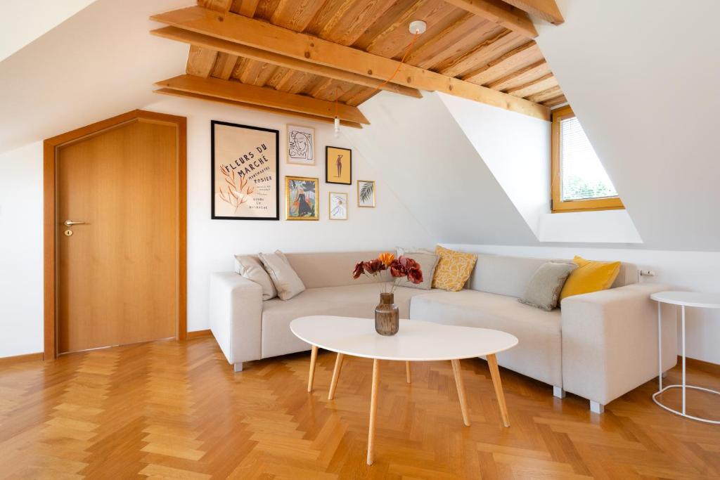 a living room with a couch and a table at Kralova Apartment in Modra in Modra