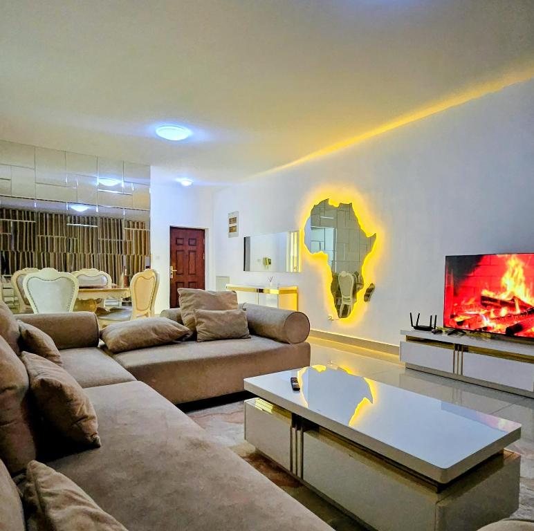a living room with two couches and a fireplace at Entire Space T3 Centralidade do Kilamba, Luanda in Luanda