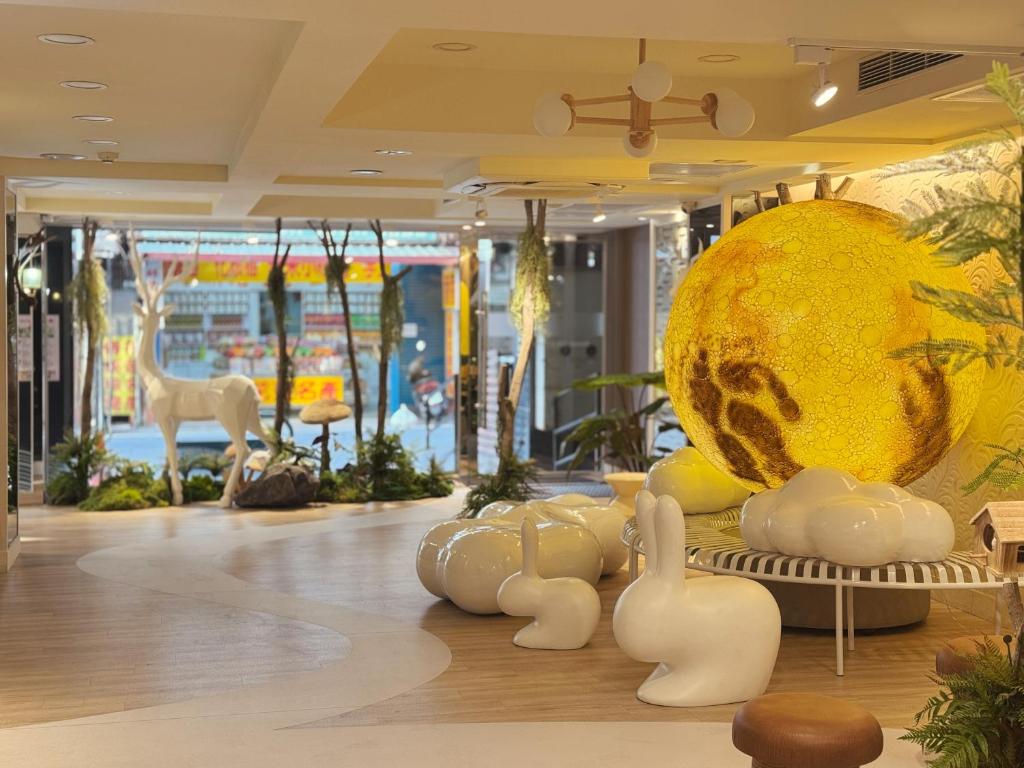 a room with a large exhibit of animals and a large ball at Finders Hotel Hualien Wen Hua in Hualien City