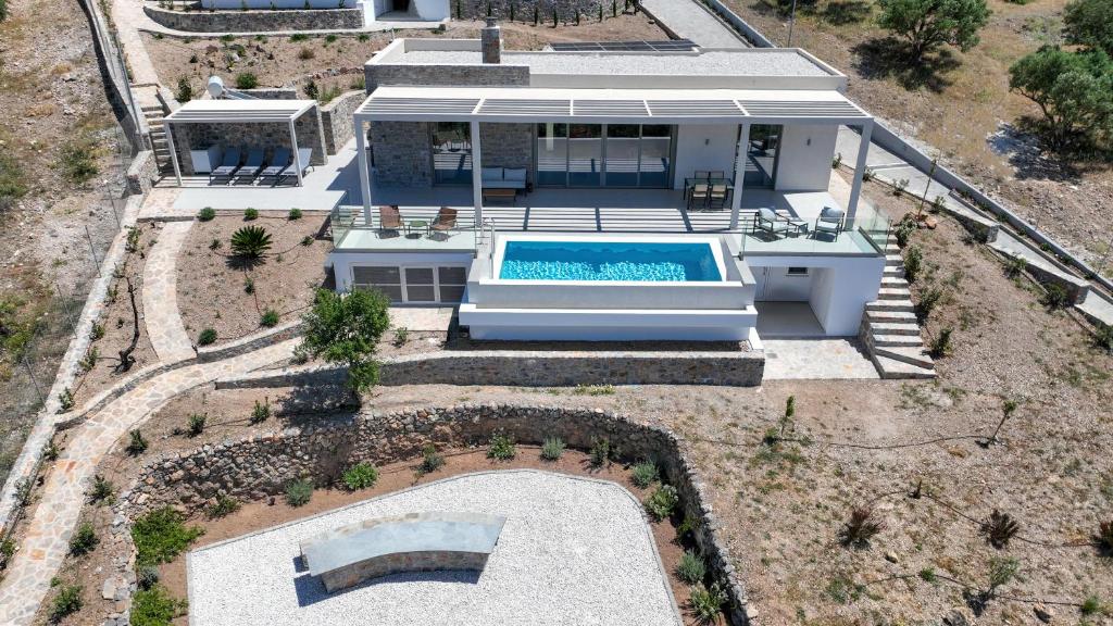 an aerial view of a house with a swimming pool at Villa Elliopetra - Adults Only in Vasilikí