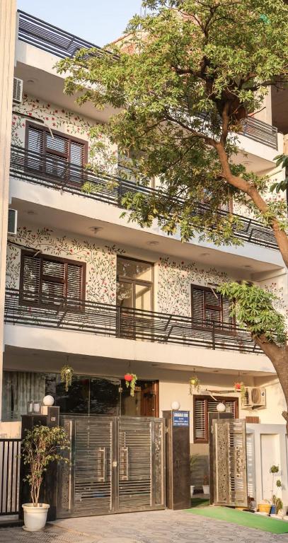 a building with balconies on the side of it at Amara Inn by Sandane Homes Near Expo mart and Pari Chowk in Greater Noida