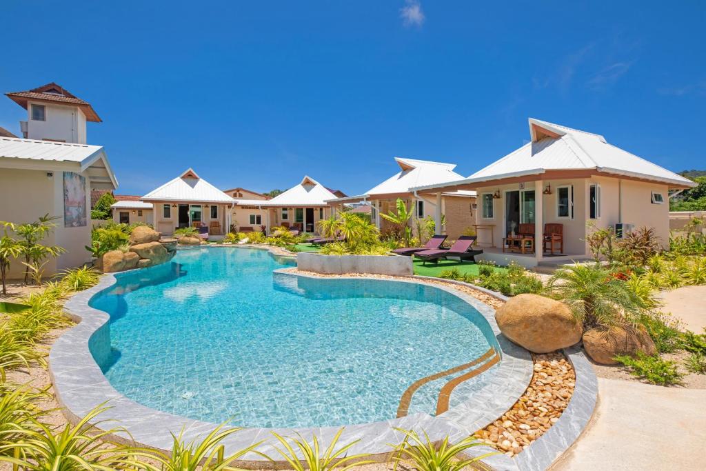 an image of a swimming pool in a villa at The Hidden Lagoon in Rawai Beach