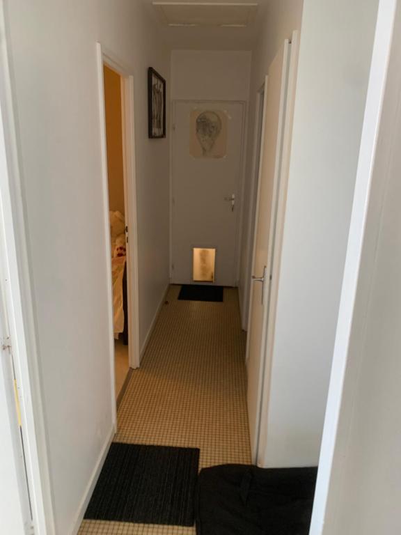 a hallway leading to a room with at Ma maison in Bonneuil-Matours