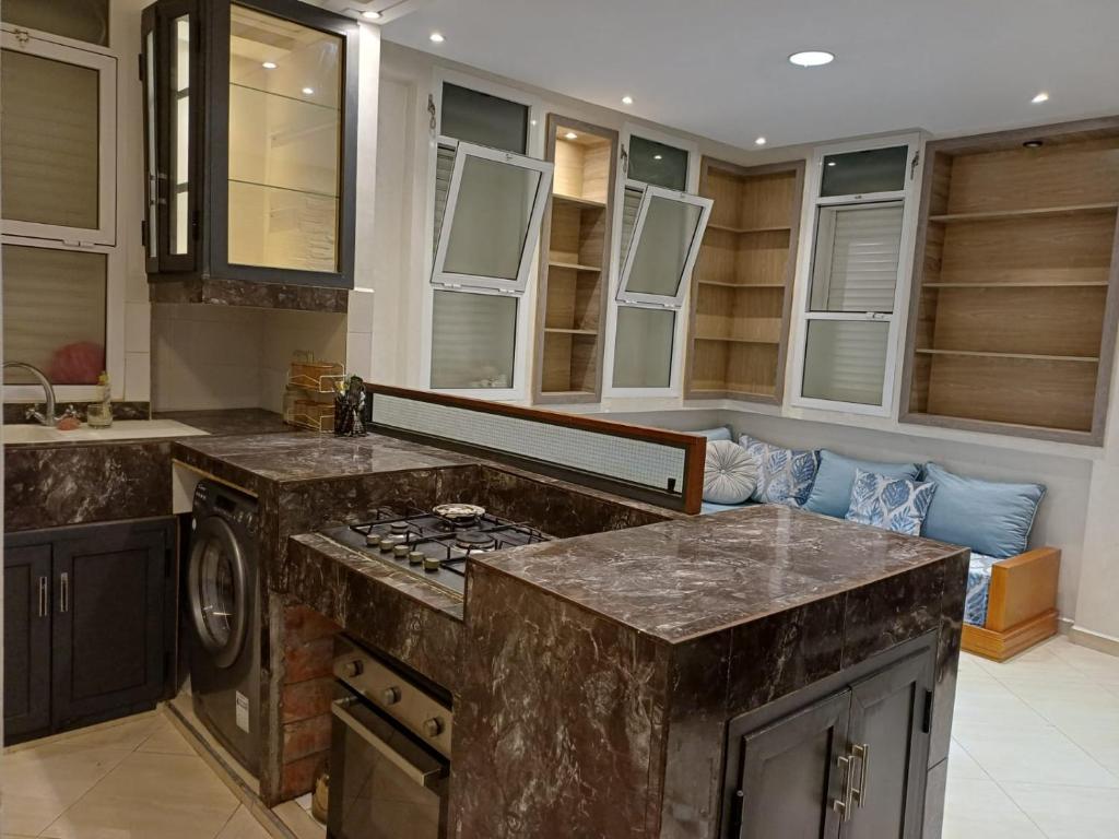 a kitchen with a counter top and a stove at Easy Stay Agadir in Agadir