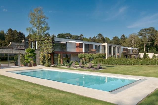 a large house with a swimming pool in front of it at The Walled Garden House Rooms Only Not Entire House in Mundford