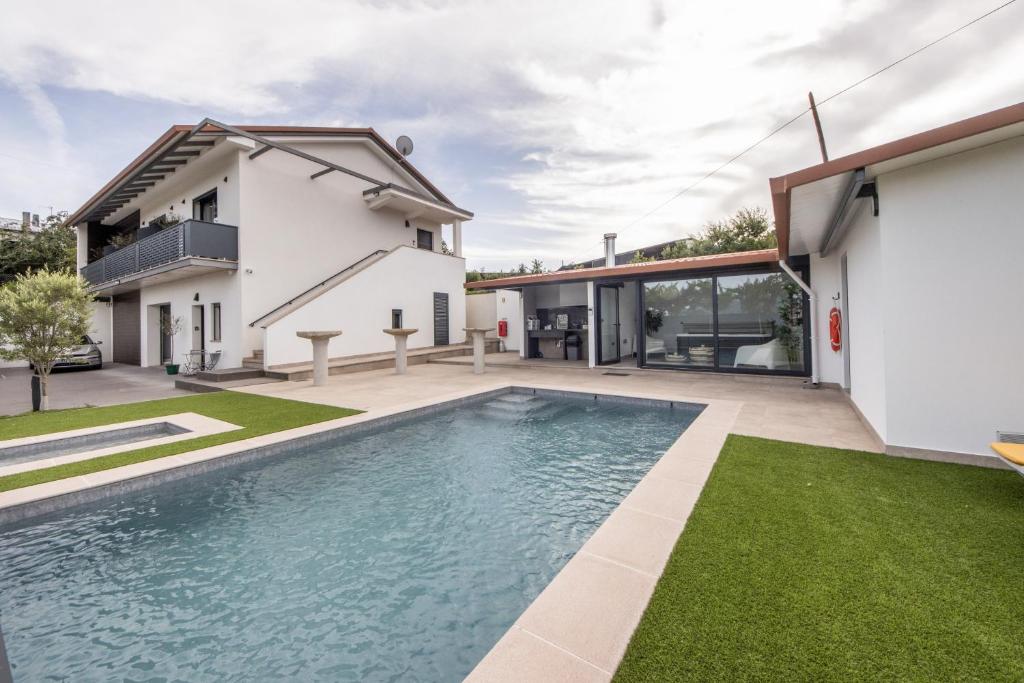 a swimming pool in the backyard of a house at Olive Studios in Campo de Arca