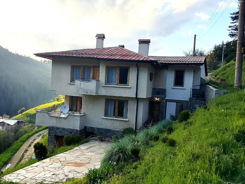 a house on the side of a hill at The House in Stoykite
