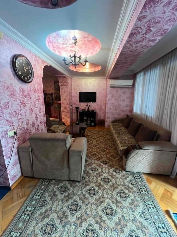 a living room with a couch and a rug at there is no a name in Itʼkhvisi