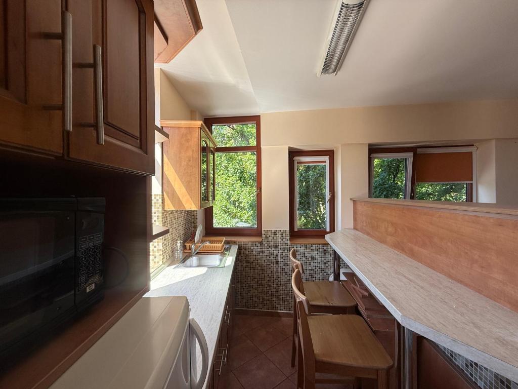 a kitchen with a counter and some windows at Balaton Vista in Balatonfüred