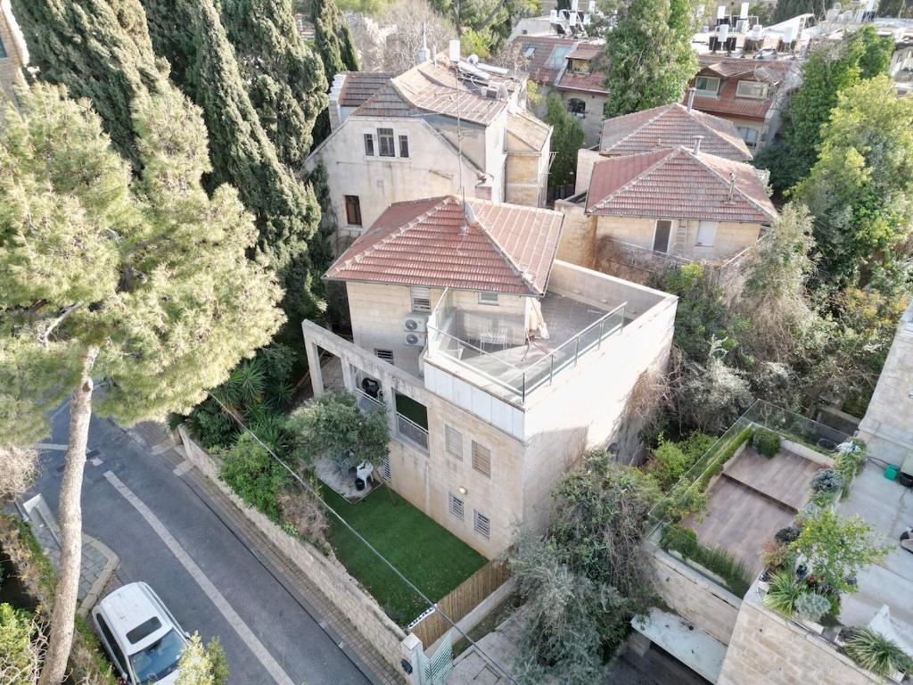 an overhead view of a large house with a street at Kosher Villa in earth of Moshava in Jerusalem