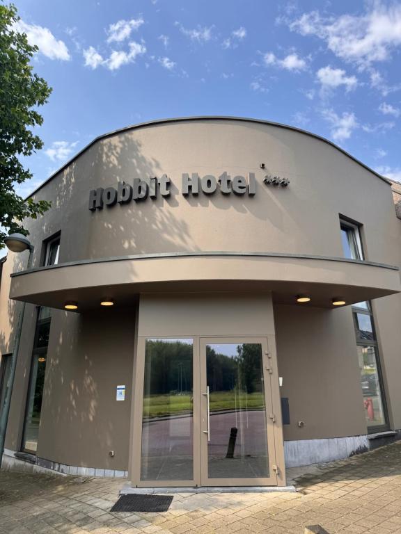 a building with the door to a hudbit hotel at Hobbit Hotel Brussels Airport Zaventem in Zaventem