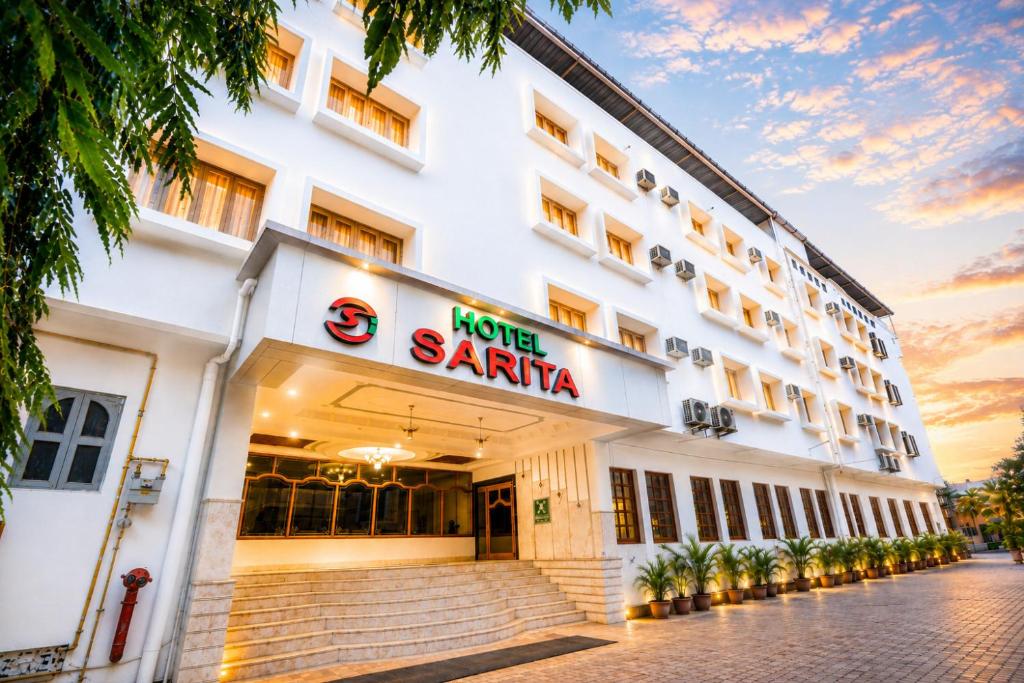 a hotel in santa clara with a sunset at Hotel Sarita - Near Surat Railway Station in Surat