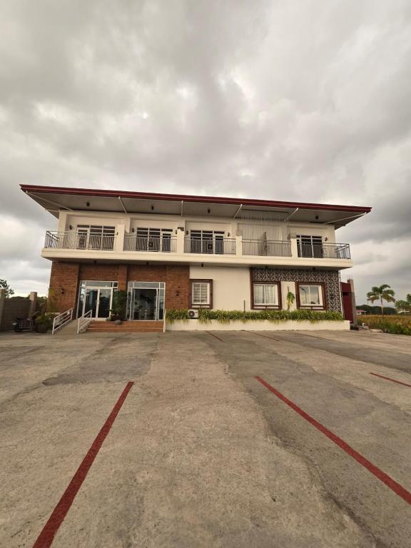an empty parking lot in front of a building at MSD Resort Hotel in Bengcag