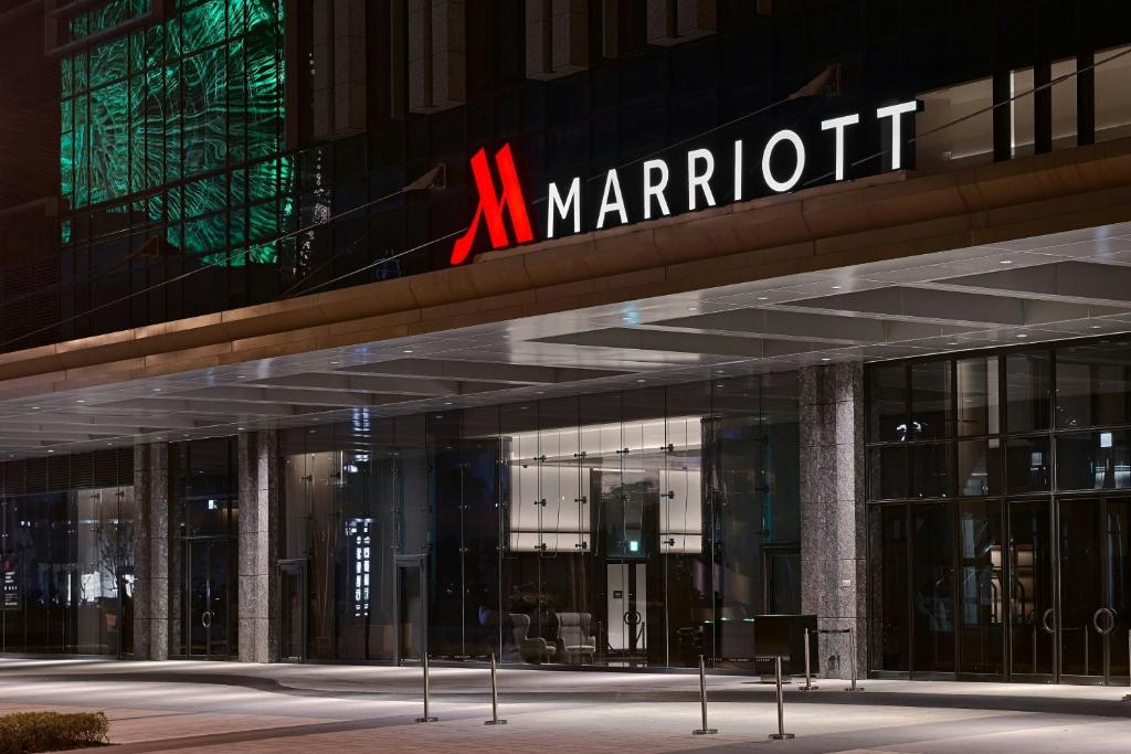 a m marriott building with a sign on it at Taipei Marriott Hotel in Taipei