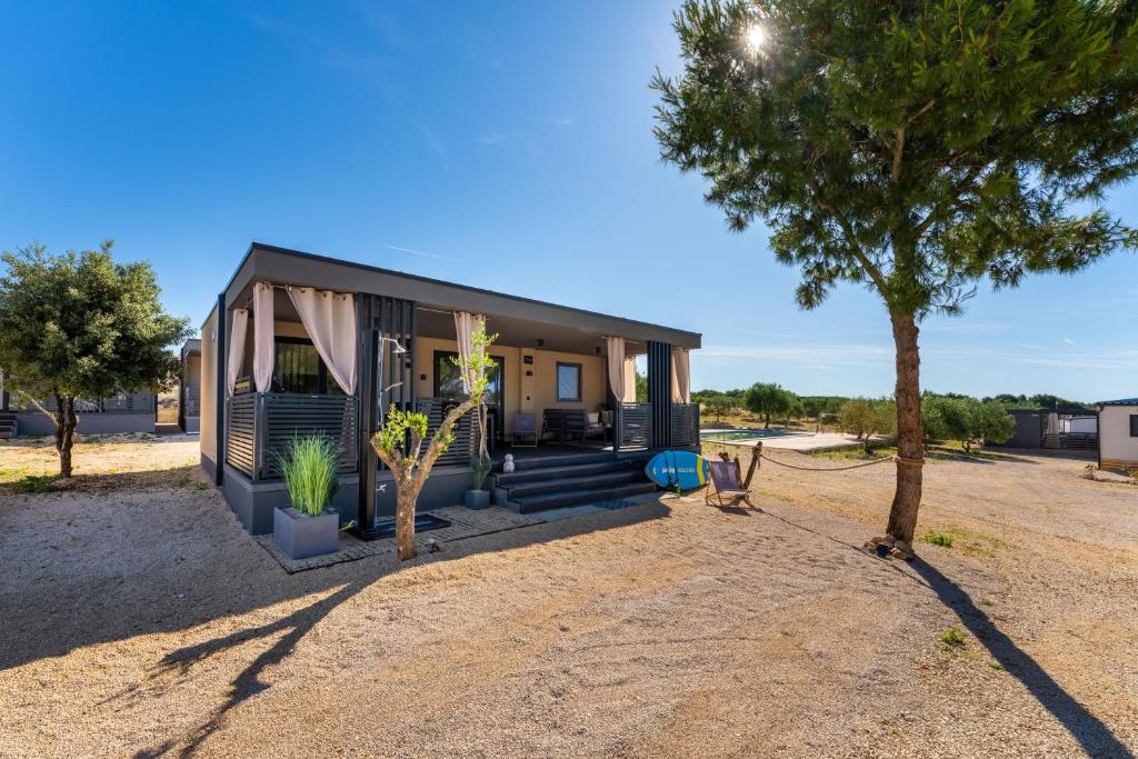 a small house in the middle of a field at Casa Mare Drage in Drage