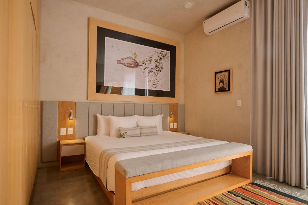 a bedroom with a large bed in a room at Casa Carmen Reforma in Oaxaca City