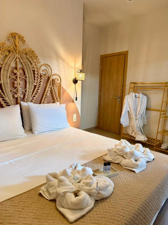 a hotel room with towels on a bed at Santa Rosa Apartments in Kalamata