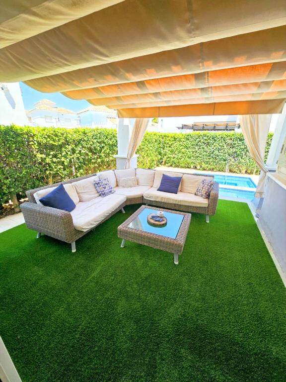 a living room with a couch and a table at Villa with private pool and jacuzzi - EN10LT in Torre-Pacheco