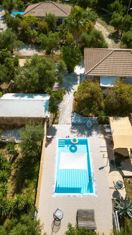 an overhead view of a swimming pool at a resort at Botonis Houses - Modern Villas, Timeless Beauty in Vasilikos