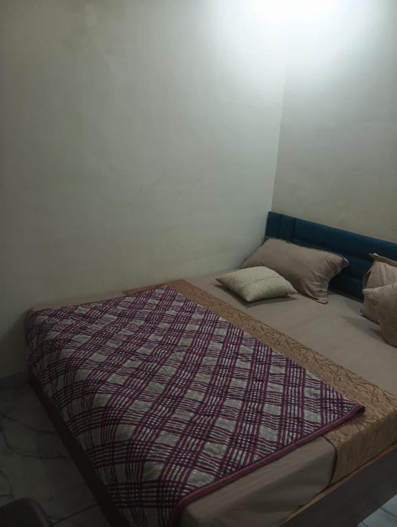 a large bed in a room with a bed sidx sidx sidx at hotel shaurya in Naroda