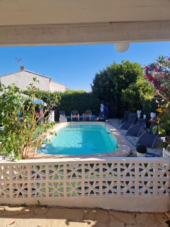 a swimming pool with a white fence around it at VILLA Soleil et Douceur in La Seyne-sur-Mer