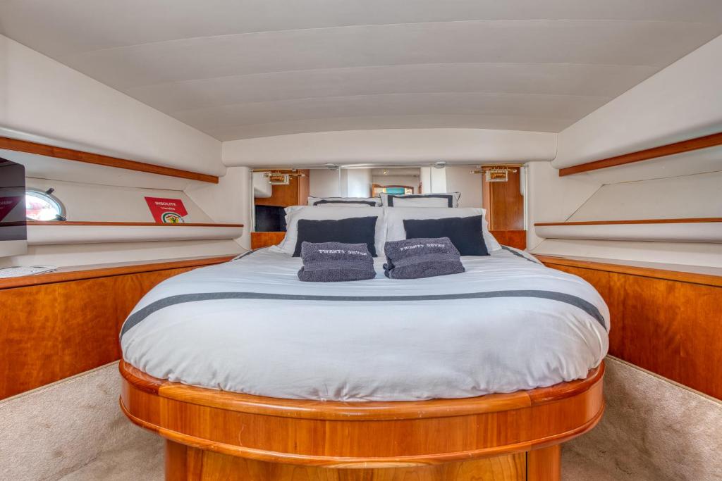 a large bed in the middle of a boat at yacht Twenty Seven in Les Sables-d'Olonne