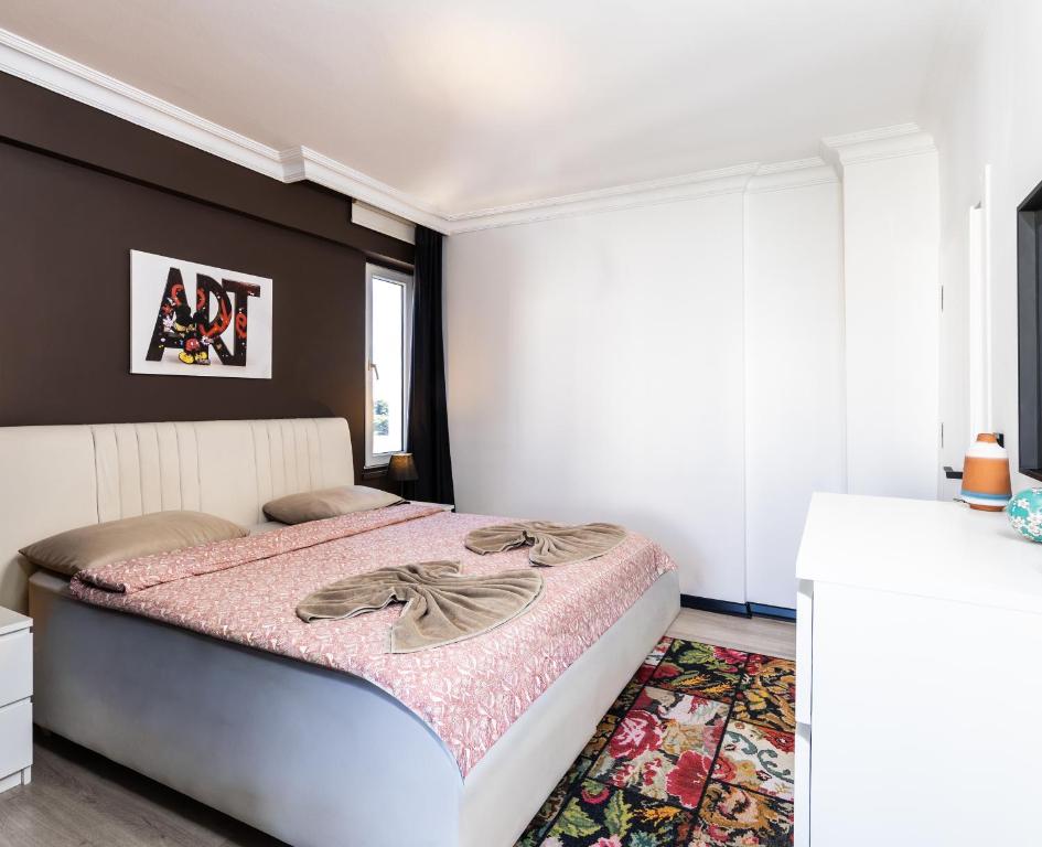 a bedroom with a large bed in a room at Melissas Suites Lara in Antalya