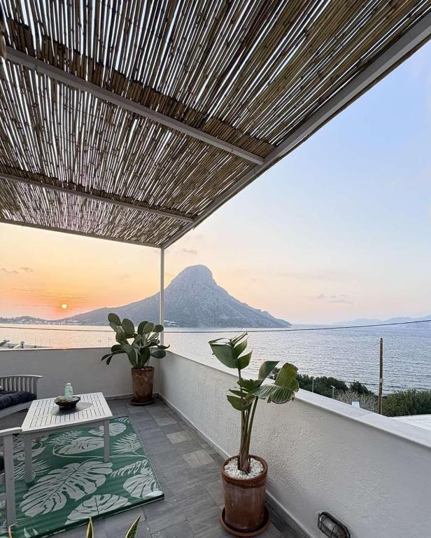 a balcony with a view of the ocean at Manifesto Seaview Apartment I in Kalymnos