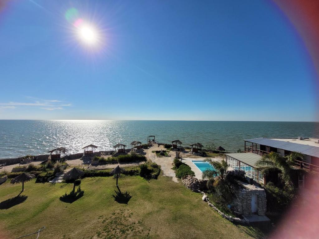 an aerial view of the ocean and a resort at Punta Encanto Posada Boutique in Miramar