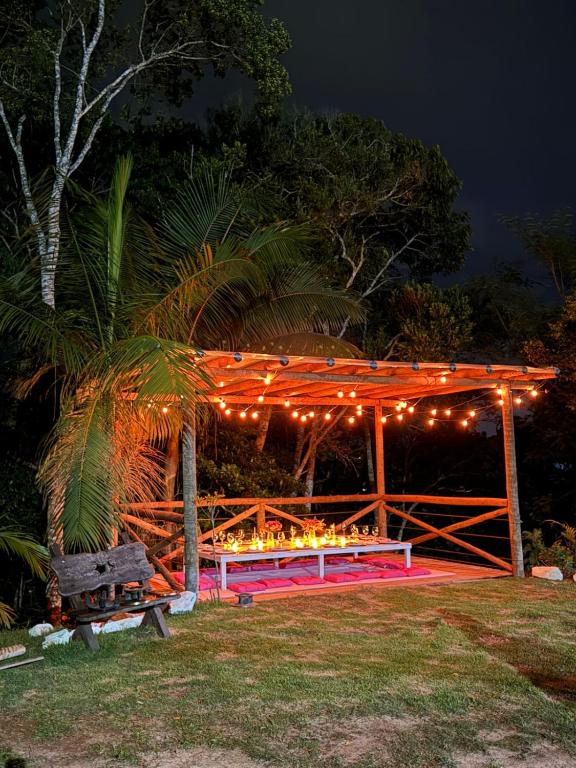 a gazebo with lights on it at night at Recanto Iluminado in Juquitiba