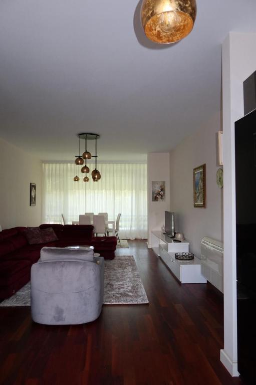 a living room with a couch and a table at Vila 26, Lura 2, Gjiri i Lalezit in Ishëm