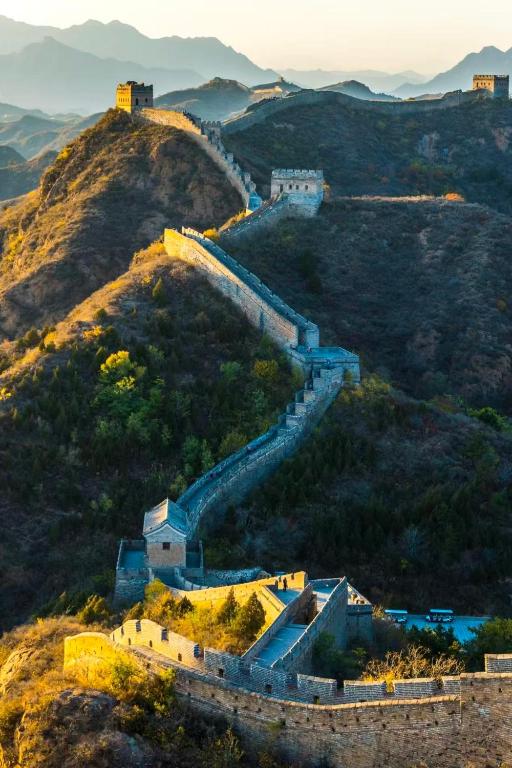 an aerial view of the great wall of china at BeiJing Mutianyu Hills Pool Wall Resort view at the foot of Mutianyu Great Wall, infinity pool, one-way PEK airport pick-up, free laundry and coffee in Huairou