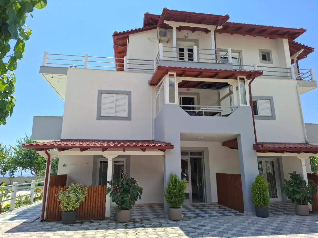 a villa with a view of the house at Yard Paradise Rooms in Dhërmi