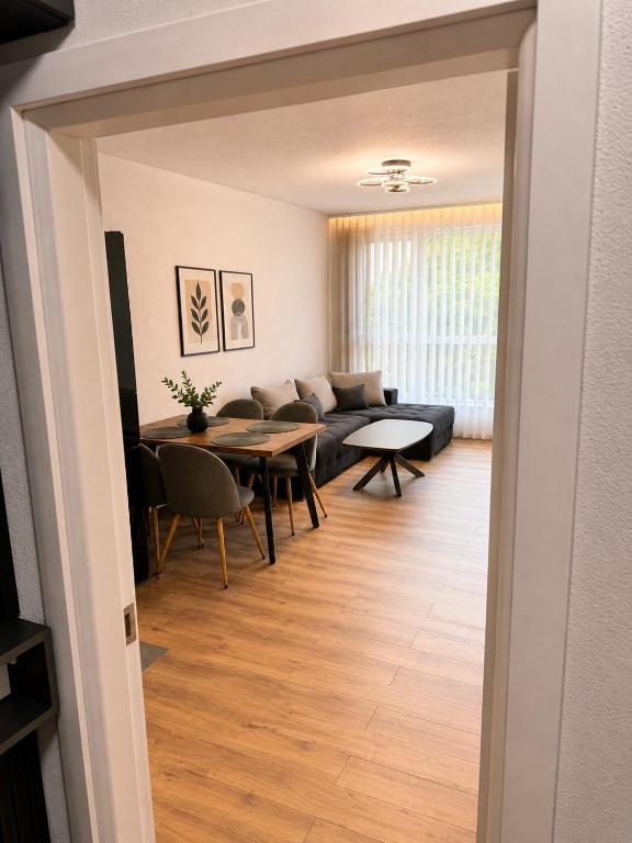 a living room with a couch and a table at Boutique apartment green 2 in Plovdiv