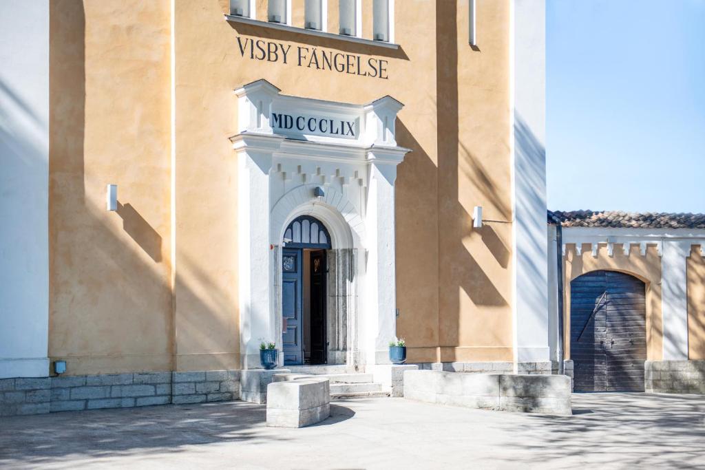 an entrance to a building with a sign on it at STF Visby Hamn Vandrarhem in Visby