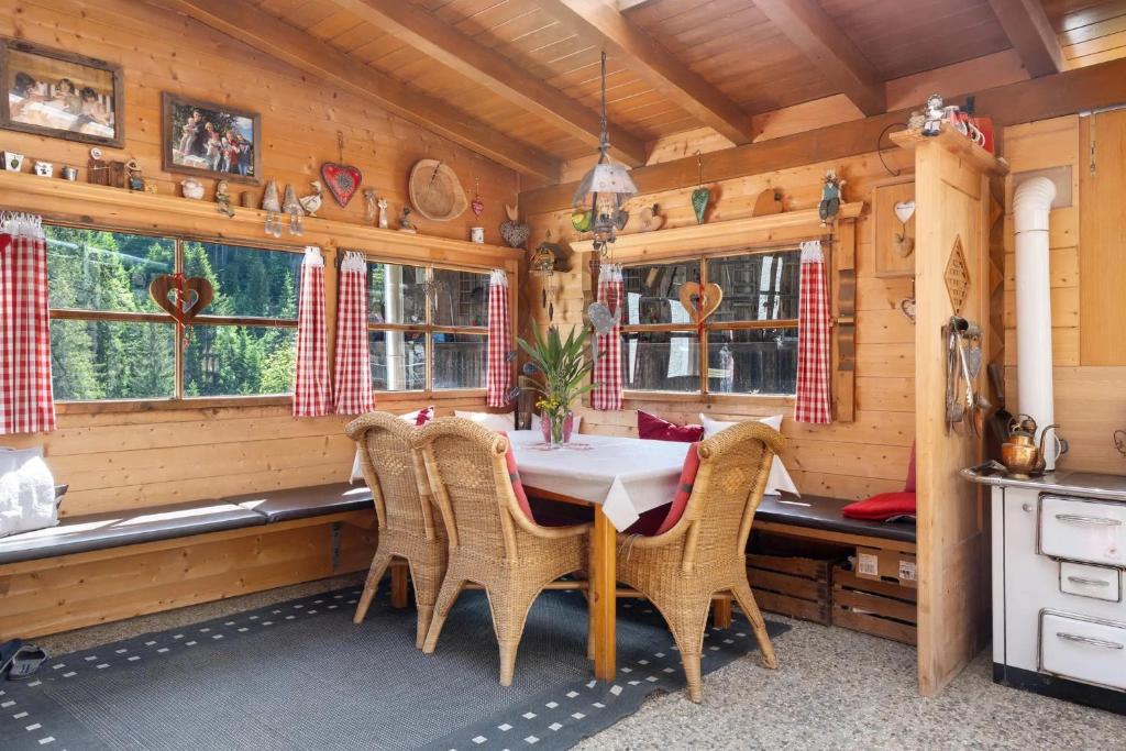 a dining room with a table and chairs at THALERHOF Onach Dolomites - Kronplatz in San Lorenzo di Sebato