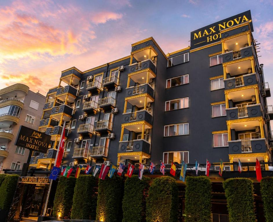 a building with a sign on the front of it at Max Nova Hotel in Alanya