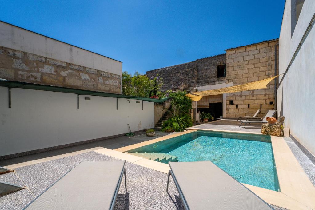 a swimming pool in the backyard of a house at Ideal Property Mallorca - Can Peret in Sa Pobla