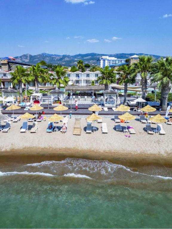 an overhead view of a beach with chairs and umbrellas at Adella Beach Resort Hotel in Kuşadası