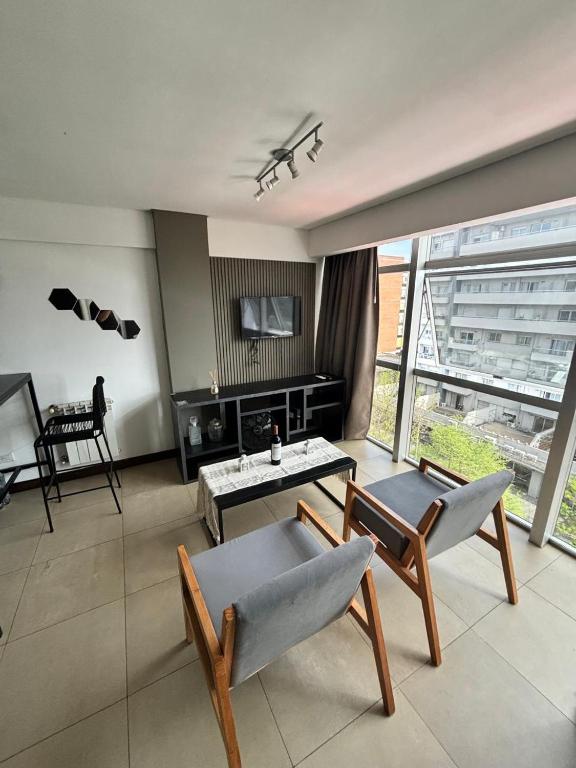 a living room with a couch and a table at monoambiente castelar in Castelar