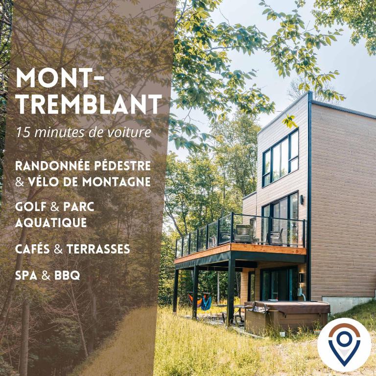 a sign for a mont tremblant home with a building at Le Yéti de Tremblant in La Conception