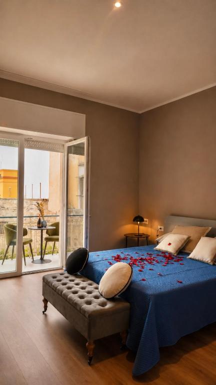 a bedroom with a large bed with a blue comforter at Vittorio Veneto Dimore in Bari
